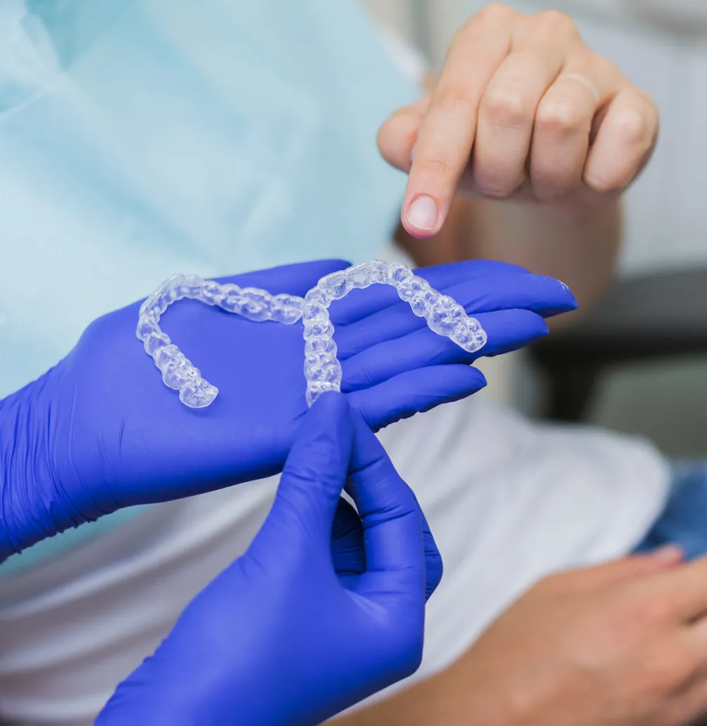 Dentist showing Pleasantville patient clear aligners