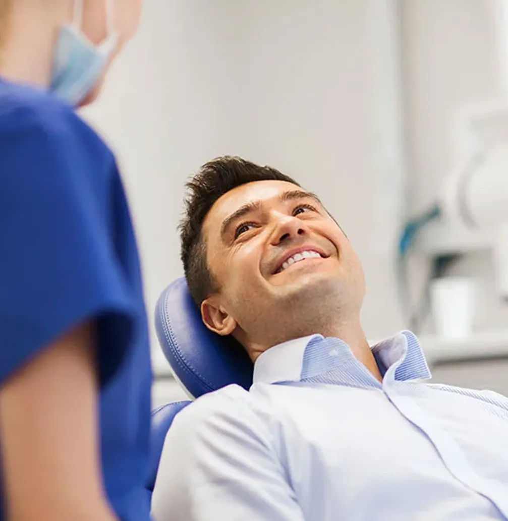 Man in dental chair smiling