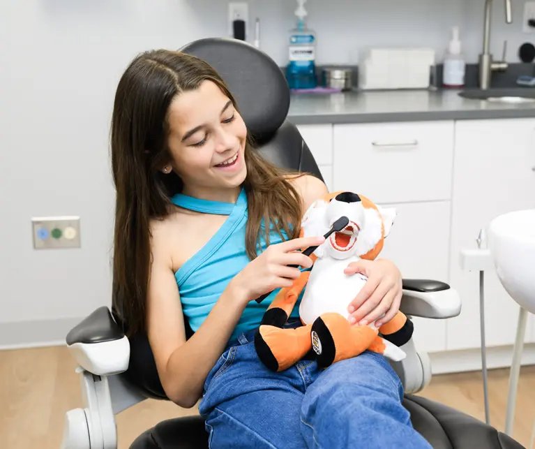 Young patient holding stuffed toy