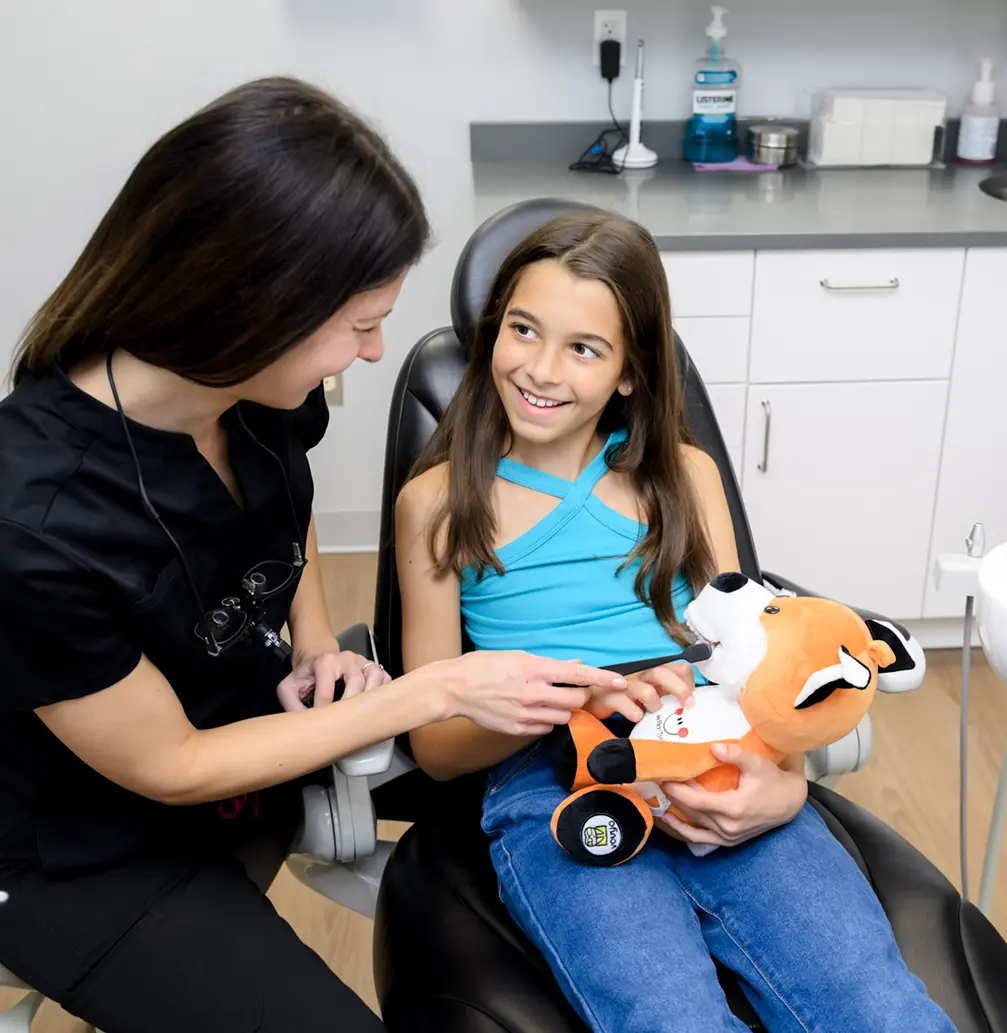 Dentist with pediatric patient